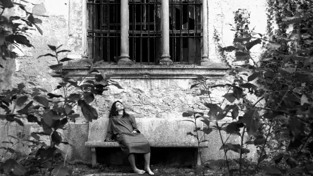 Photo of woman on bench outside
